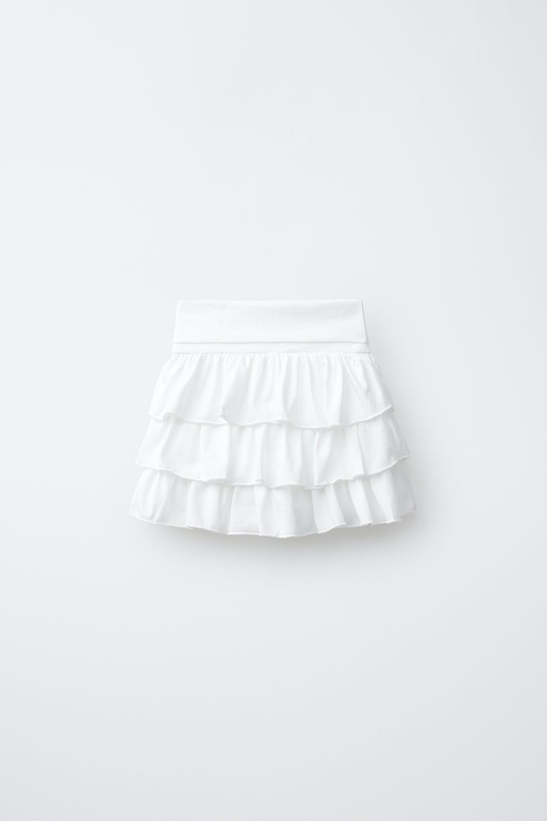 JUPE À VOLANTS ET TAILLE À REVERS