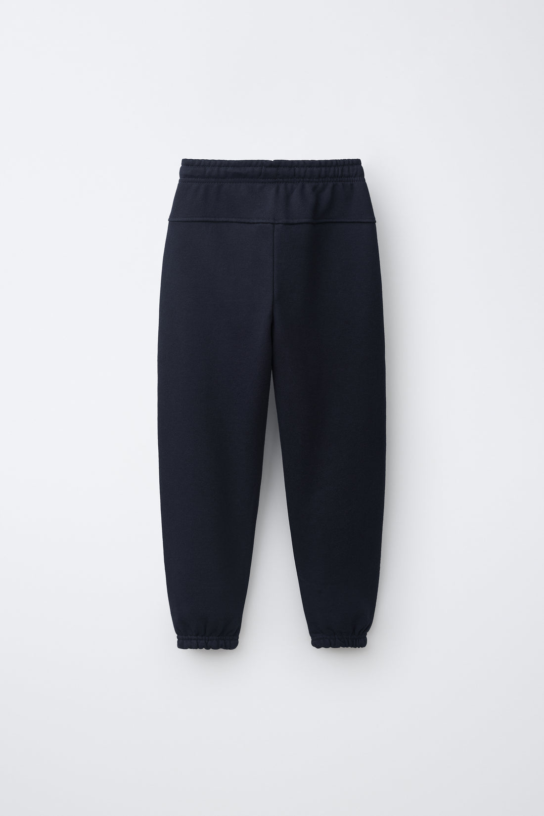 PANTALON DE JOGGING EN MOLLETON UNI AVEC ÉTIQUETTE