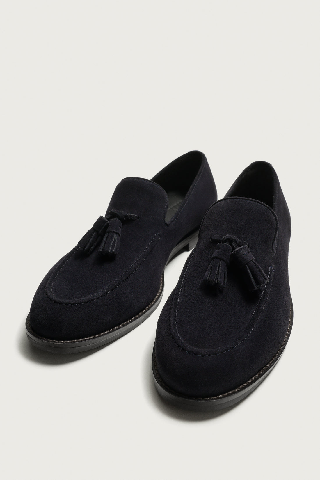 MOCASSINS EN CUIR À POMPONS
